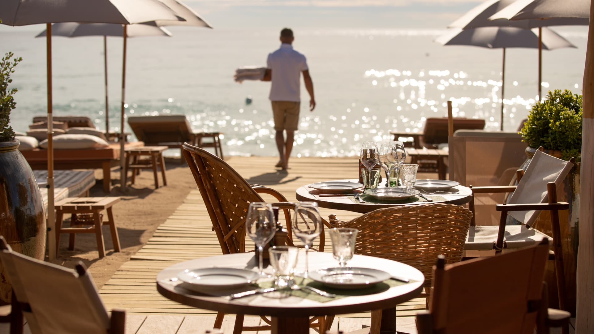 Dinner on La Réserve à la Plage's deck at golden hour