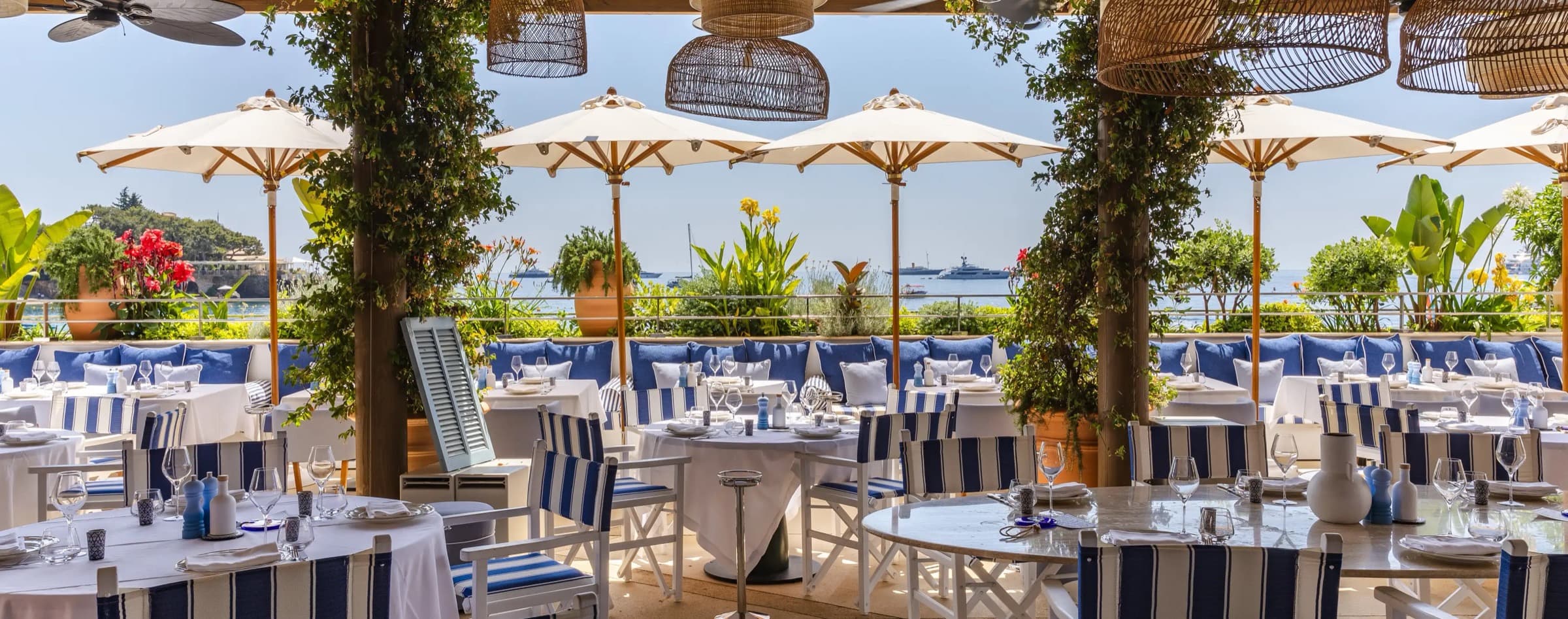 Maona Monte-Carlo's pergola, rattan lanterns facing the sea