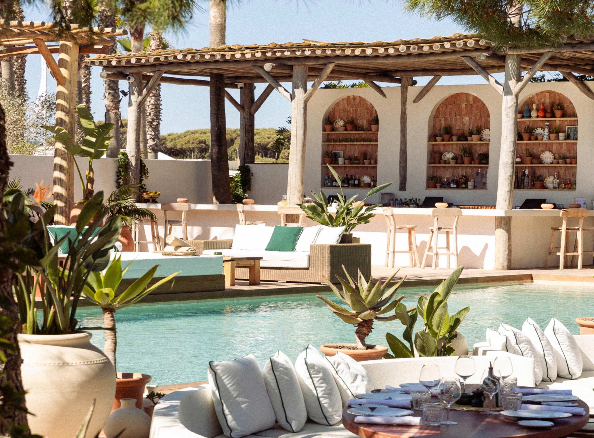 The Nikki Beach Saint-Tropez pool ringed with white sofas